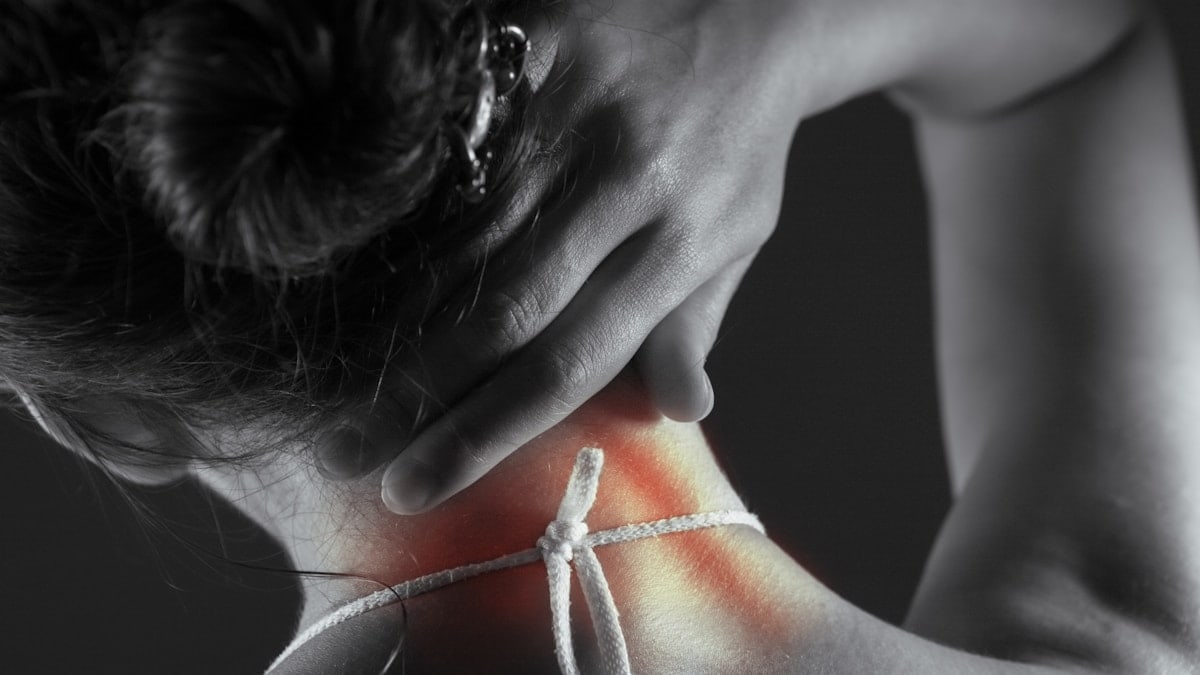 Acute pain in the back of a woman. Pain in the back and neck.